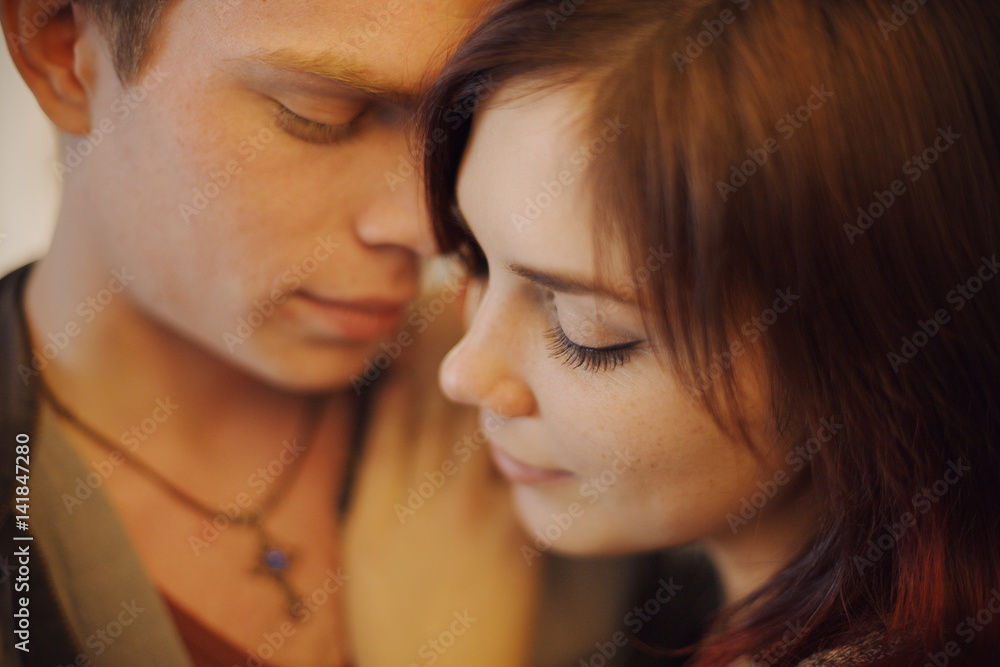 Romantic couple touching and kissing each other Romantic couple touching and kissing each other