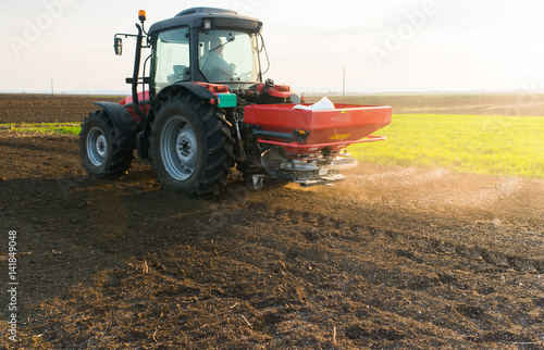 Tractor spreading artificial fertilizers © Dusan Kostic