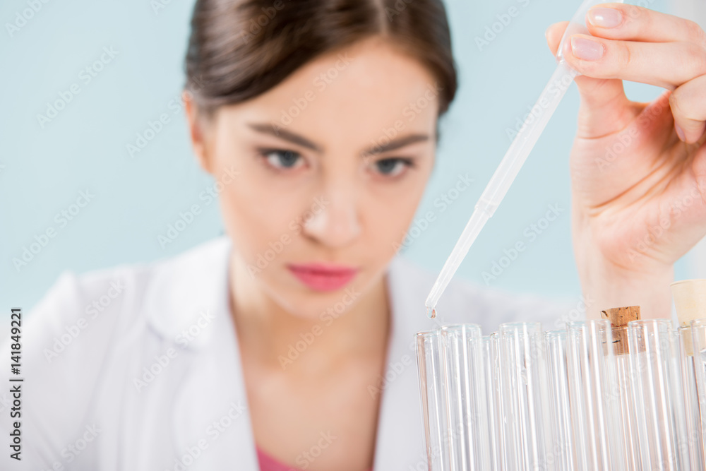 Scientist making experiment Scientist making experiment
