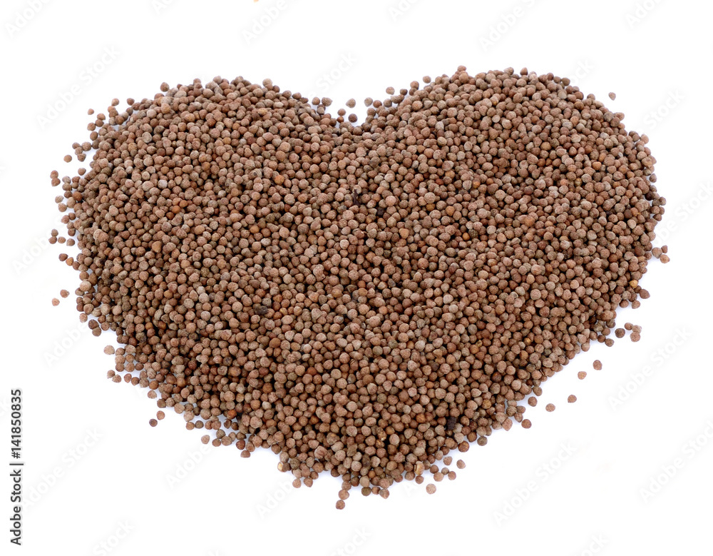 Heart-shaped Coriander seeds isolated on white background Heart-shaped Coriander seeds isolated on white background