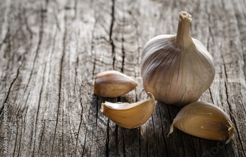 Garlic on wooden background photo