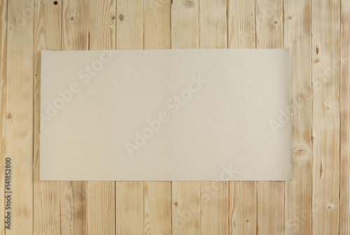 Wooden picnic table with white napkin on