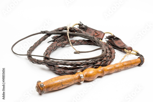Bild auf Leinwand Leather whip isolated over white background closeup macro
