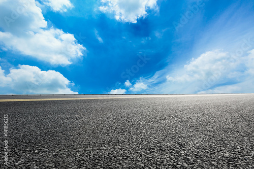 Asphalt road and blue sky © ABCDstock