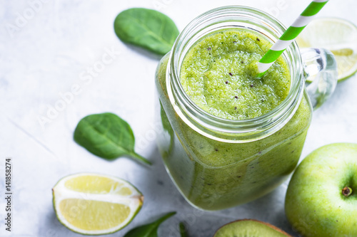 Green smoothie in mason jar. Healthy diet drink.