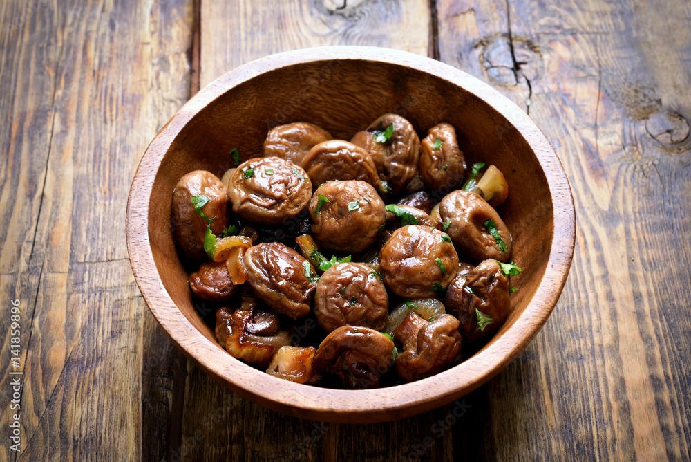 Fried mushrooms with onion in bowl Fried mushrooms with onion in bowl