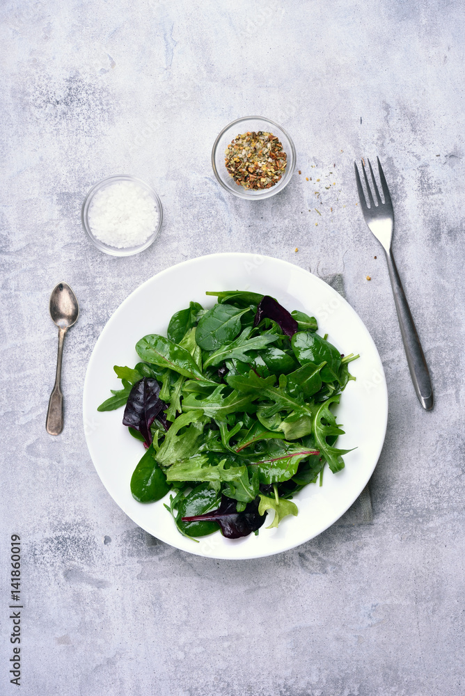 Salad with green leaves of spinach, arugul Salad with green leaves of spinach, arugul