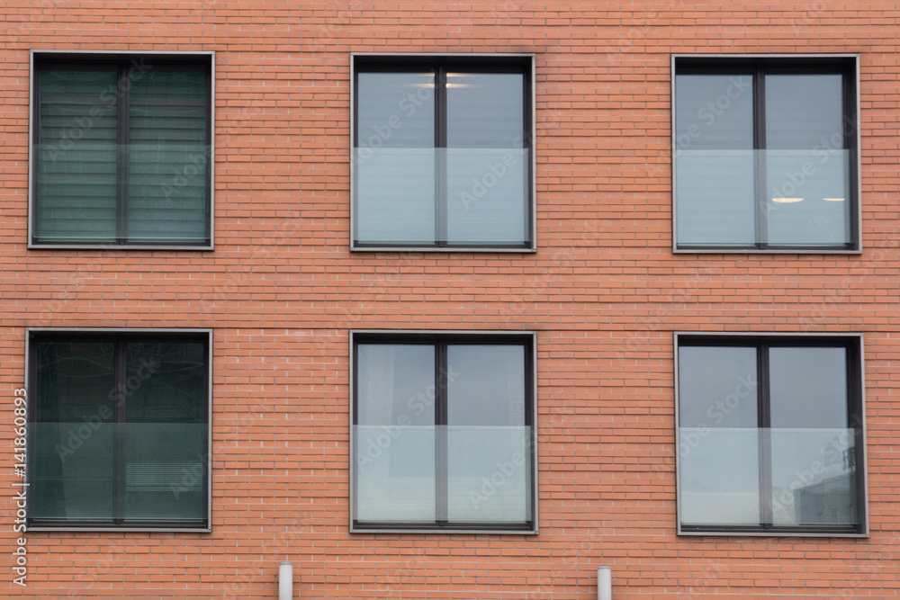Fototapeta premium Six Modern front glass windows of an new house