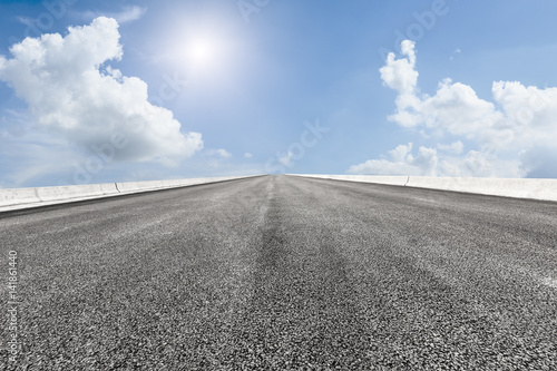 Asphalt road and blue sky