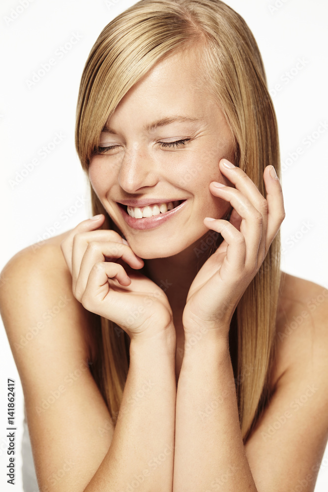 Beautiful blond woman in studio, smiling Beautiful blond woman in studio, smiling