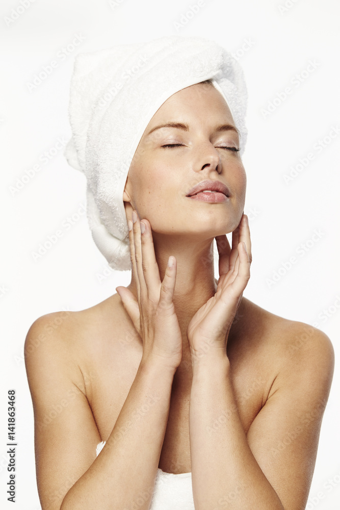 © sanneberg - Sensual woman in white towel, eyes closed