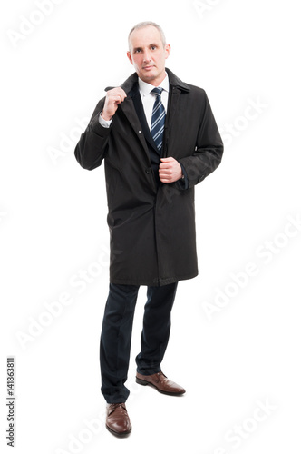 Full body of middle age business man wearing raincoat