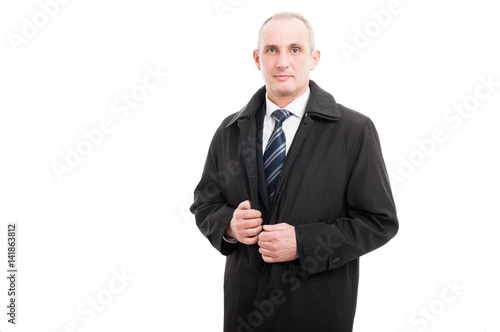 Portrait of middle age business man wearing raincoat