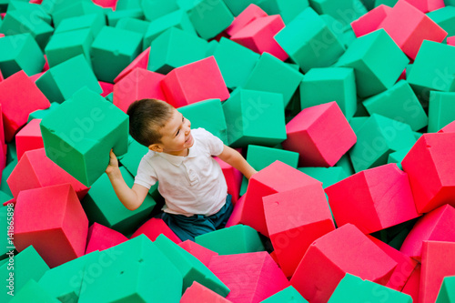 Boy playing in a dry pool photo