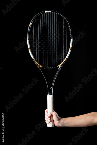 Hand with tennis racquet © LIGHTFIELD STUDIOS