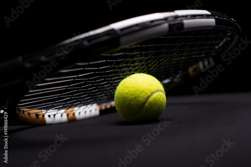 Tennis ball and racquet © LIGHTFIELD STUDIOS