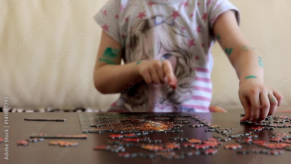 Beautiful girl being ill with chickenpox, collecting picture of puzzles at home. Play without thinking about the disease concept. The person in the green points. Beautiful girl being ill with chickenpox, collecting picture of puzzles at home. Play without thinking about the disease concept. The person in the green points.