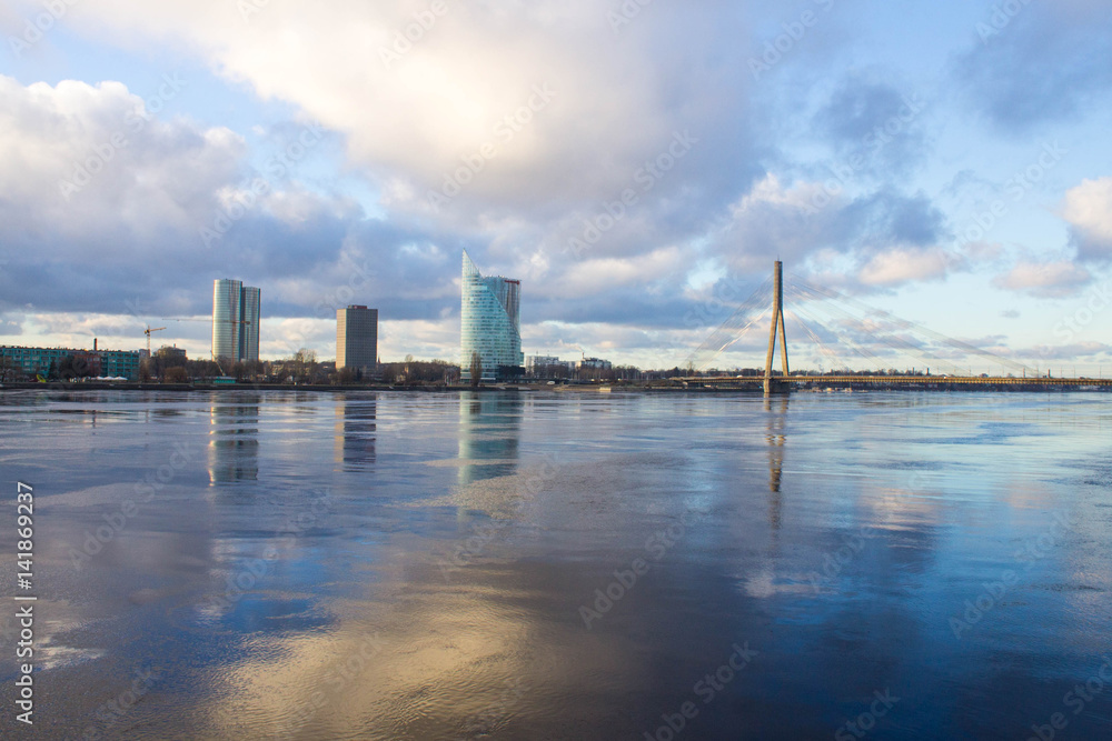 Sunset light over bridge and river in Riga, Latvia Sunset light over bridge and river in Riga, Latvia