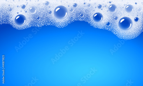 Soap foam overlying on the background of a blue water color