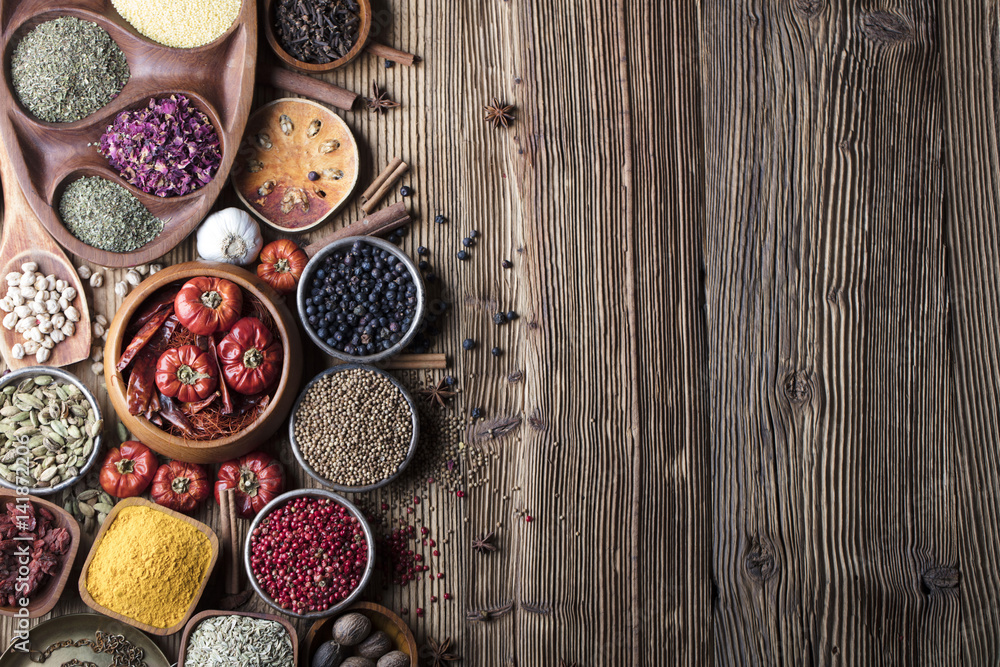 various dry spices on a wooden table various dry spices on a wooden table