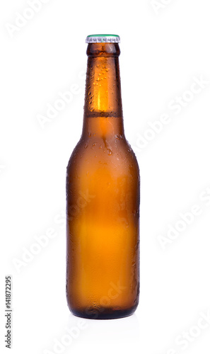 Bottle of beer with drops isolated on white background
