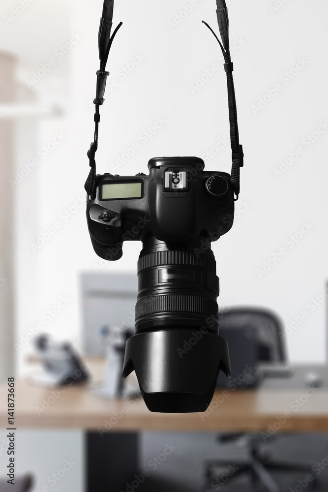 Single DSLR with office background