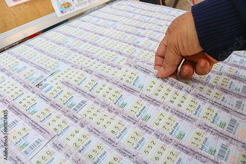 Thai government lottery tickets. Lottery tickets are sold in pairs, and each ticket has six single digits.