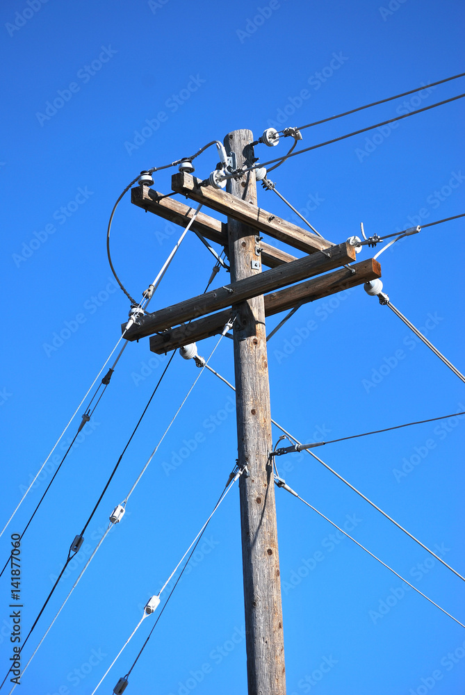 Power lines displayed high in the sky outdoors. Power lines displayed high in the sky outdoors.