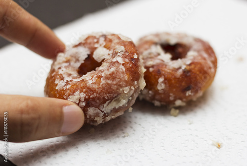 A man taking sugary dessert after lunch. photo