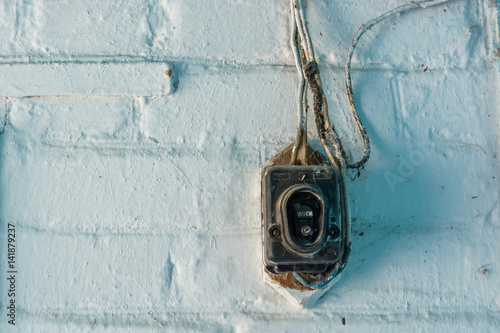 Old vintage damaged doorbell on wall © greentellect