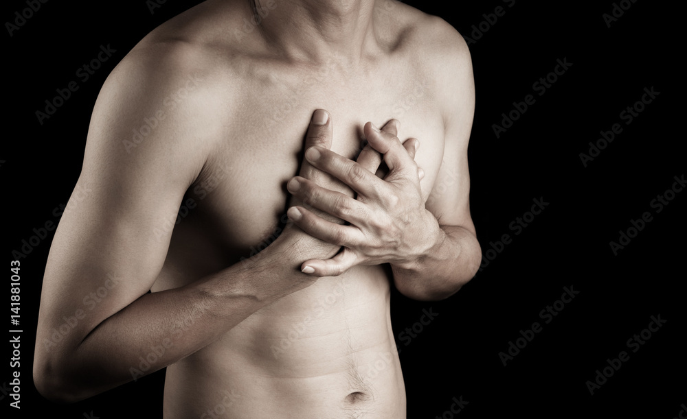 Hand of man adult touching chest with pain hurt ache on black background  people, healthcare body problem concept