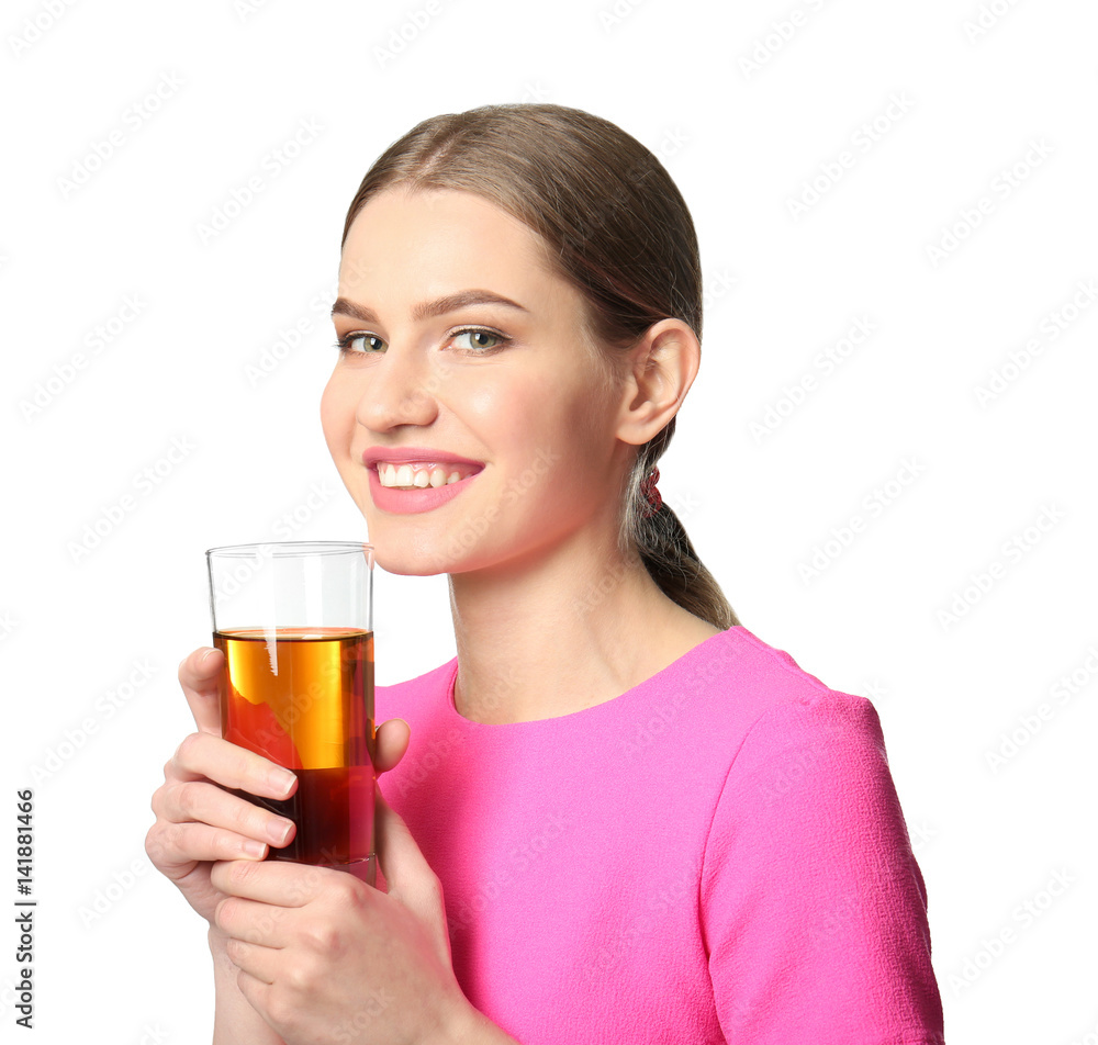 Beautiful young woman with glass of fresh juice on light background Beautiful young woman with glass of fresh juice on light background
