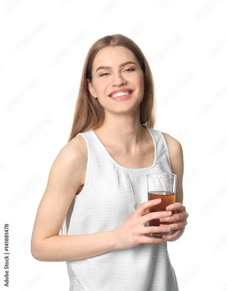 Beautiful young woman with glass of fresh juice on light background Beautiful young woman with glass of fresh juice on light background
