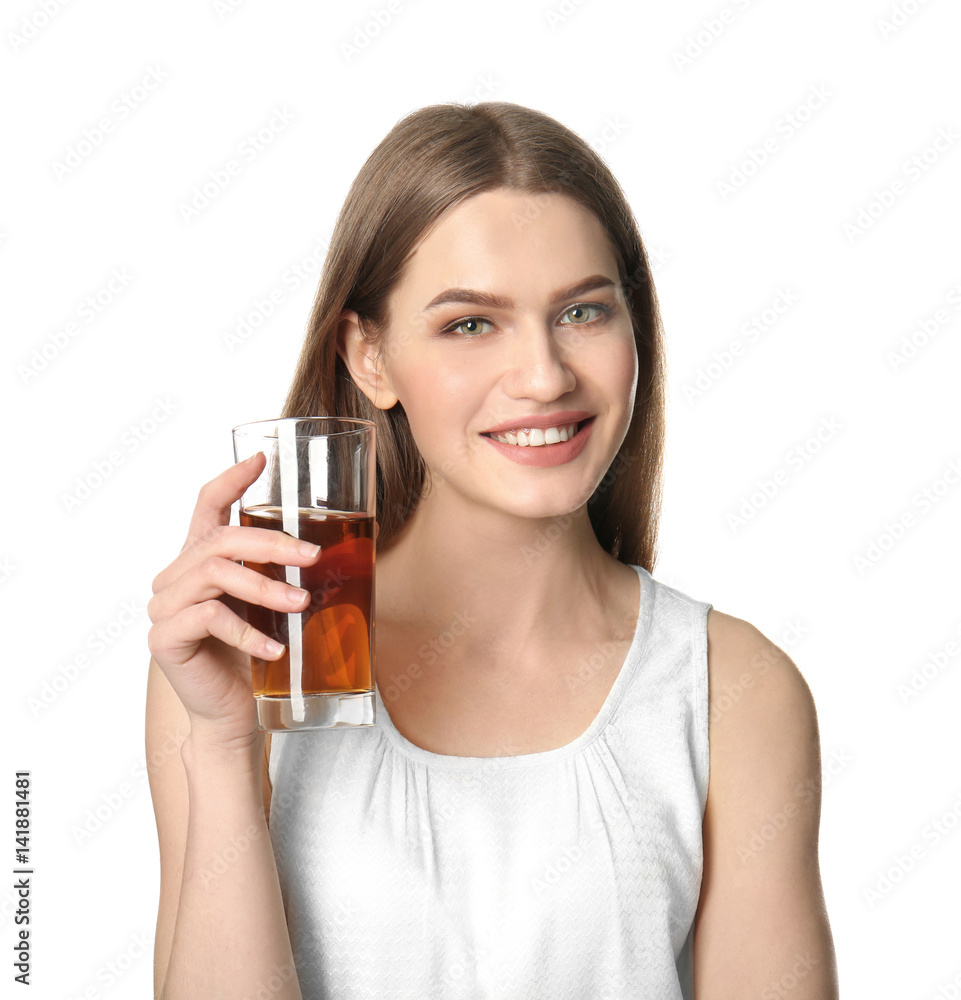 Beautiful young woman with glass of fresh juice on light background Beautiful young woman with glass of fresh juice on light background