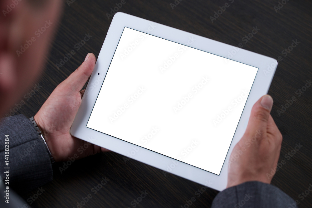 Close up of man using tablet. White screen. Close up of man using tablet. White screen.
