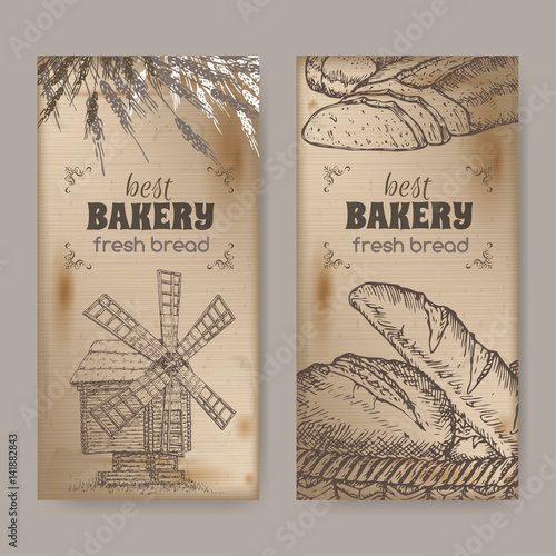 Two bakery label templates with wooden windmill, wheat and bread on vintage background