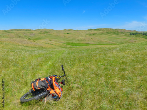 Mountain bike with a backpack in the mountains