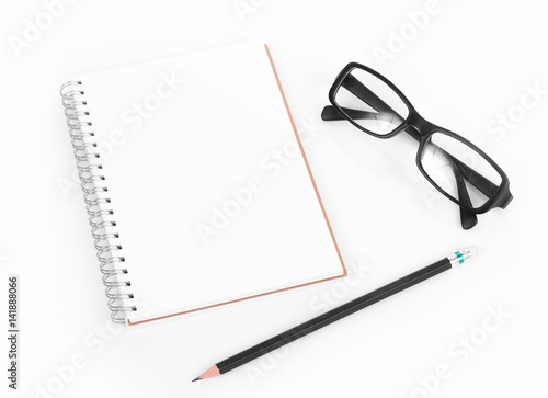 Blank diary, pencil, and glasses on white background