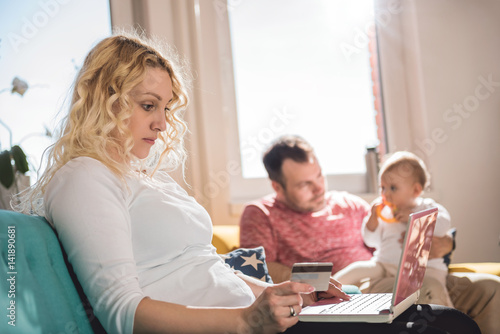 Mother Exercise With Her Baby At Home