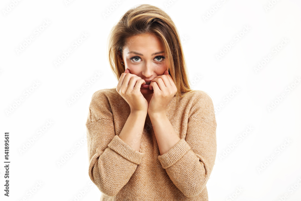Afraid woman looking at camera isolated on a white background Afraid woman looking at camera isolated on a white background