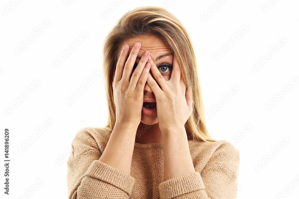Afraid woman looking at camera isolated on a white background Afraid woman looking at camera isolated on a white background
