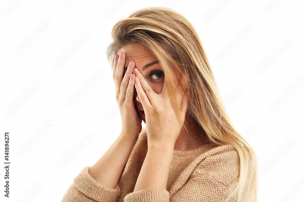 Afraid woman looking at camera isolated on a white background Afraid woman looking at camera isolated on a white background