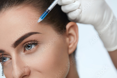 Plastic Surgery. Beautiful Woman Receiving Beauty Injections