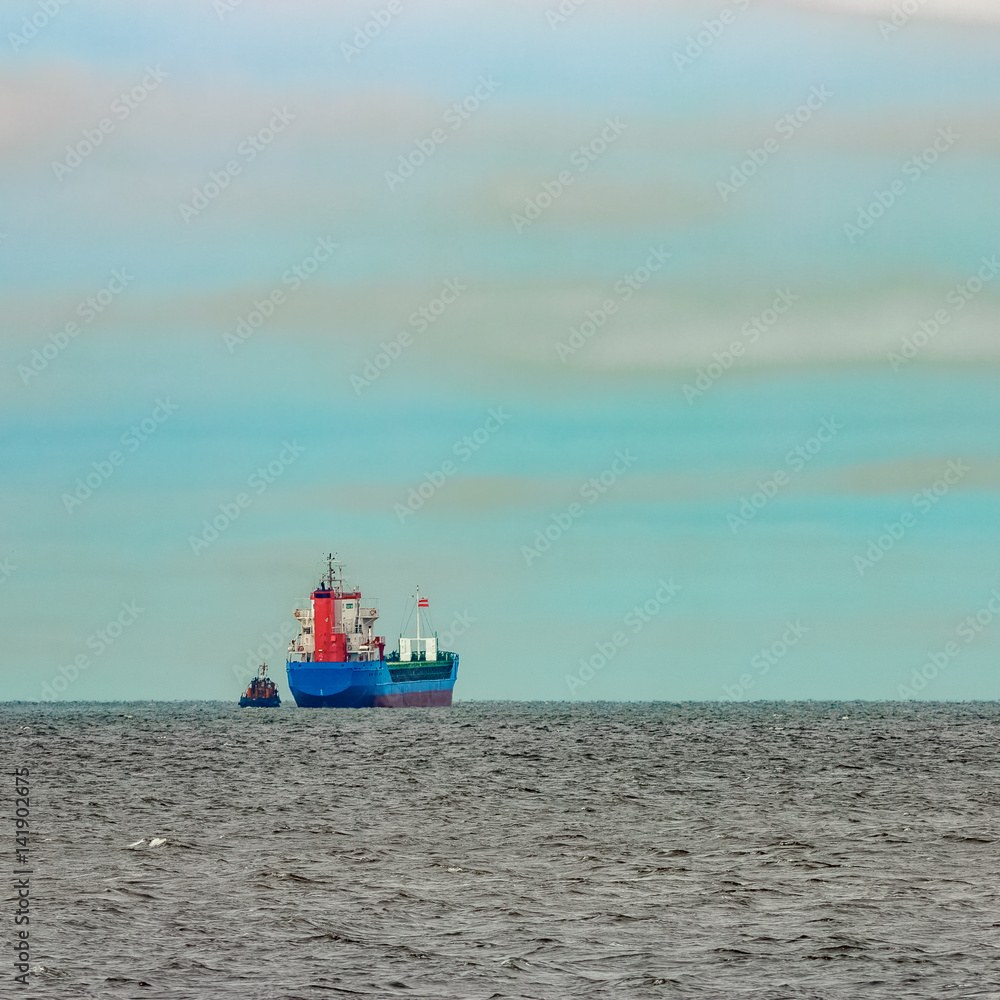 Blue cargo ship entering the Baltic sea. Riga, Europe Blue cargo ship entering the Baltic sea. Riga, Europe