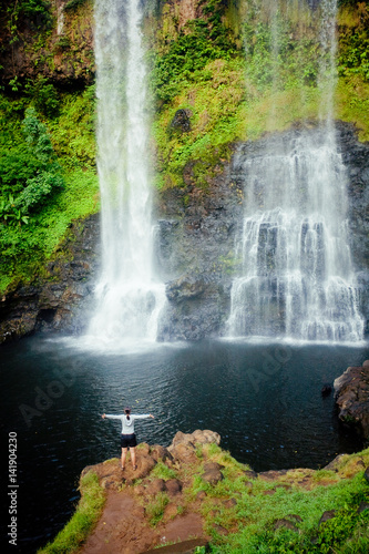 Winner near waterfall. Active life concept