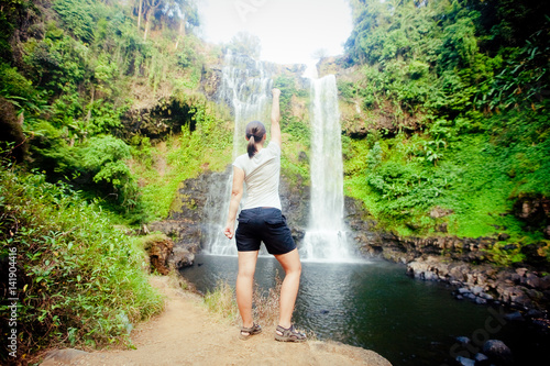 Winner near waterfall. Active life concept