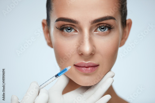 Portrait Of Beautiful Young Woman Getting Cosmetic Treatment
