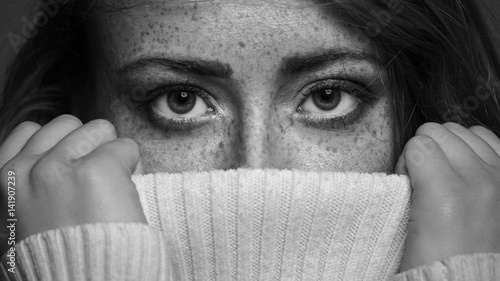 Black and white portrait of a beautiful freckled woman