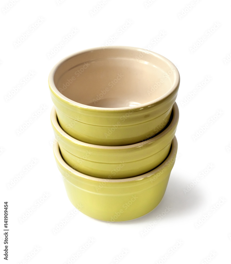 Glazed ceramic pots for cooking on a white background with clipping