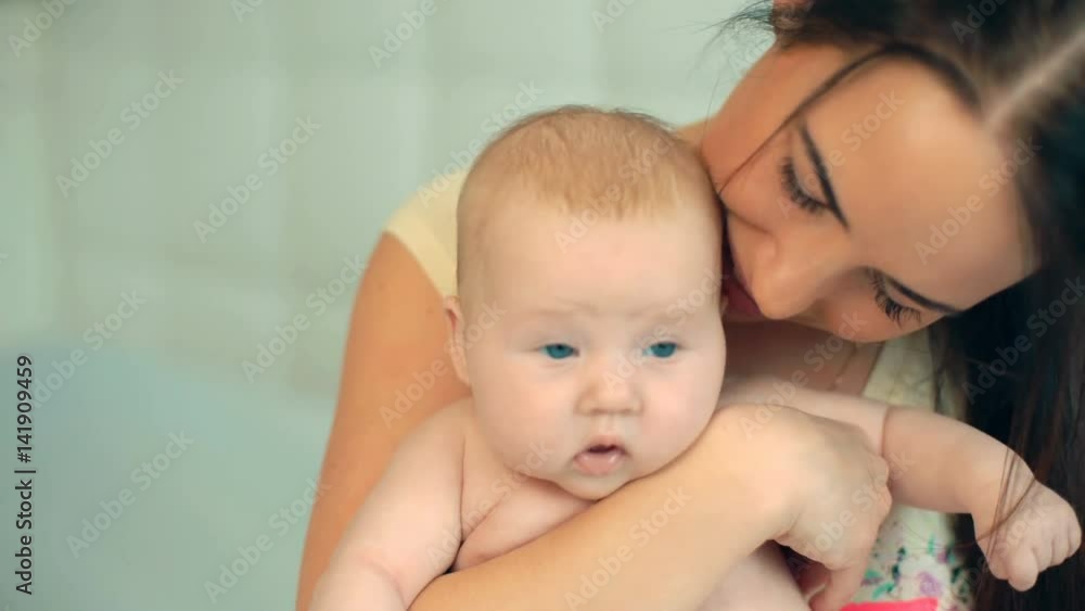 Happy mother playing with her newborn baby. Happy mother playing with her newborn baby.